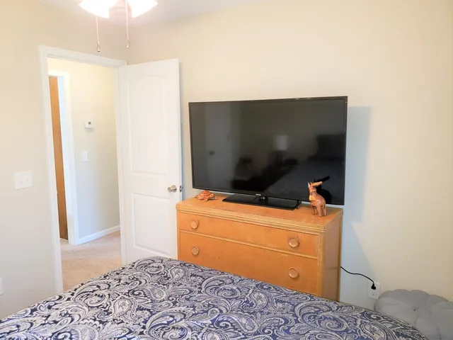 a view of a bathroom with a sink and a mirror