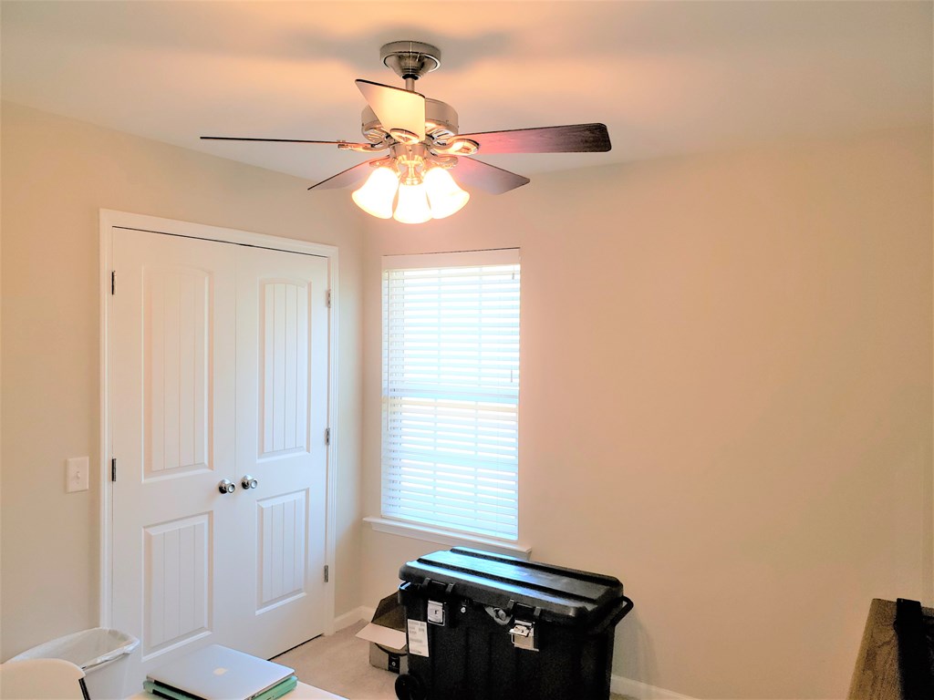 7842 Lloyd Road Columbus, GA 31909 - Photo 24 of 31 a room with a window and a chandelier fan