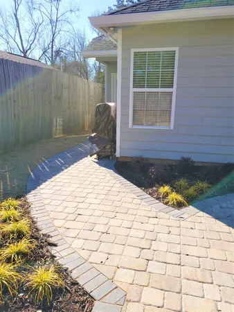 a view of a backyard with a patio