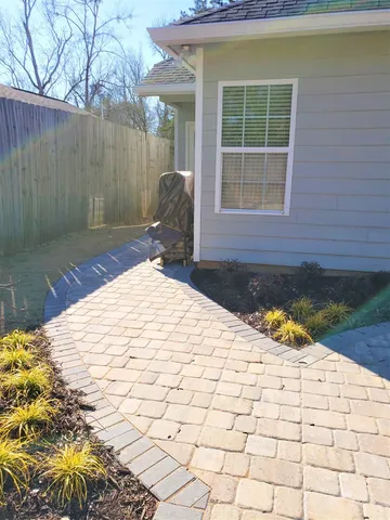 a view of a backyard with a patio