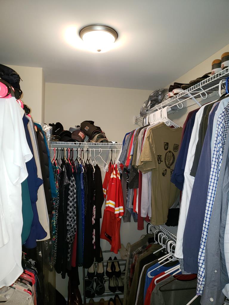 7842 Lloyd Road Columbus, GA 31909 - Photo 31 of 31 a view of walk in closet with clothes and shoes