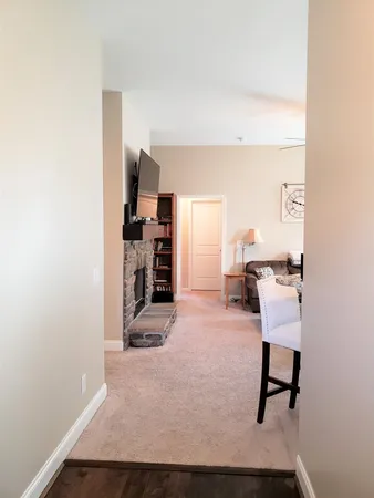 a view of a room with workspace and a window