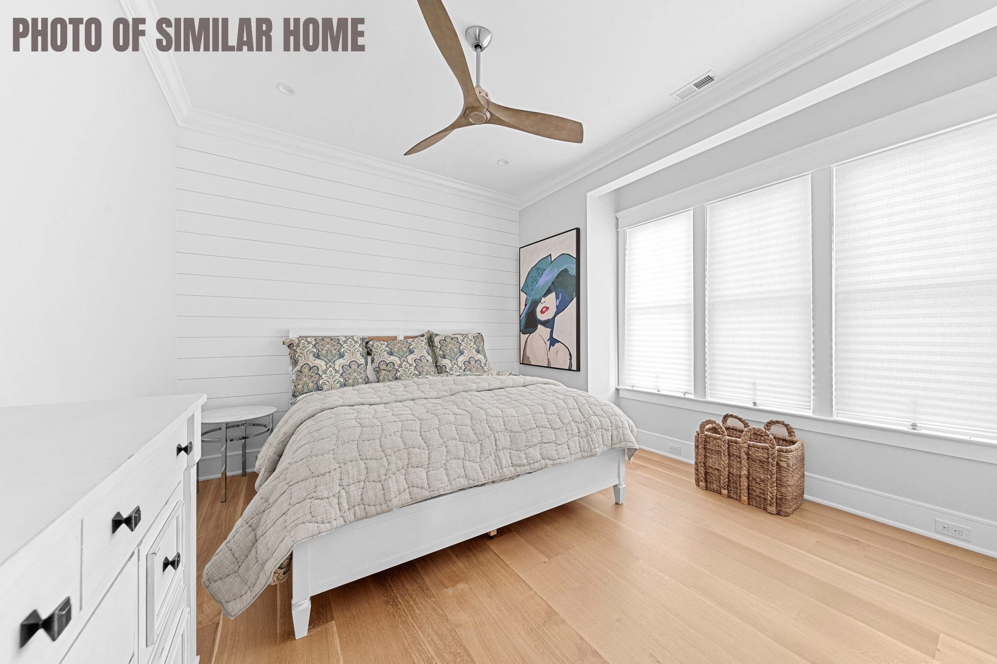 154 98th Street Stone Harbor, NJ 08247 - Photo 19 of 50 a spacious bedroom with a bed and a large window