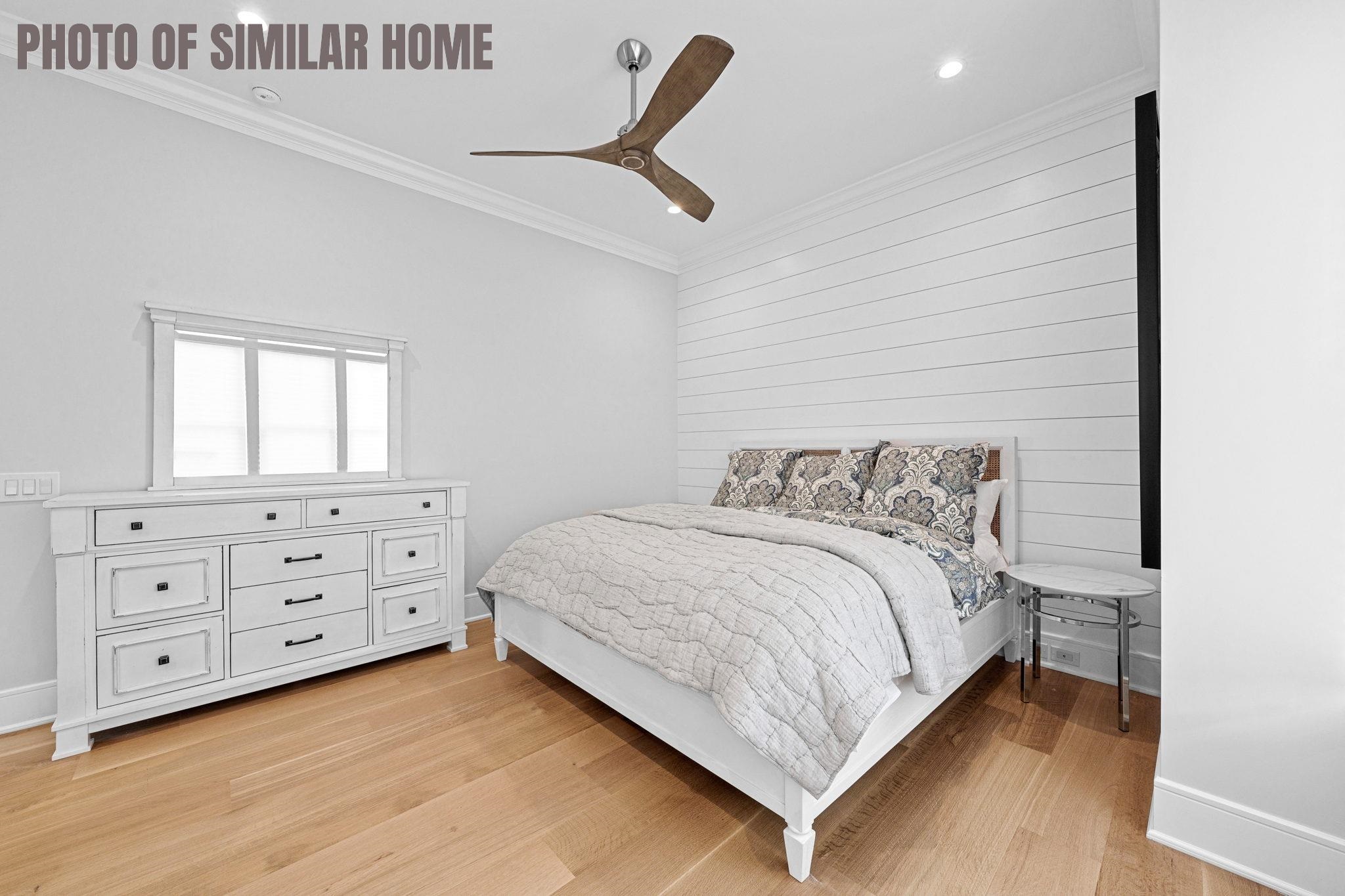 154 98th Street Stone Harbor, NJ 08247 - Photo 23 of 50 a bedroom with a bed and a dresser