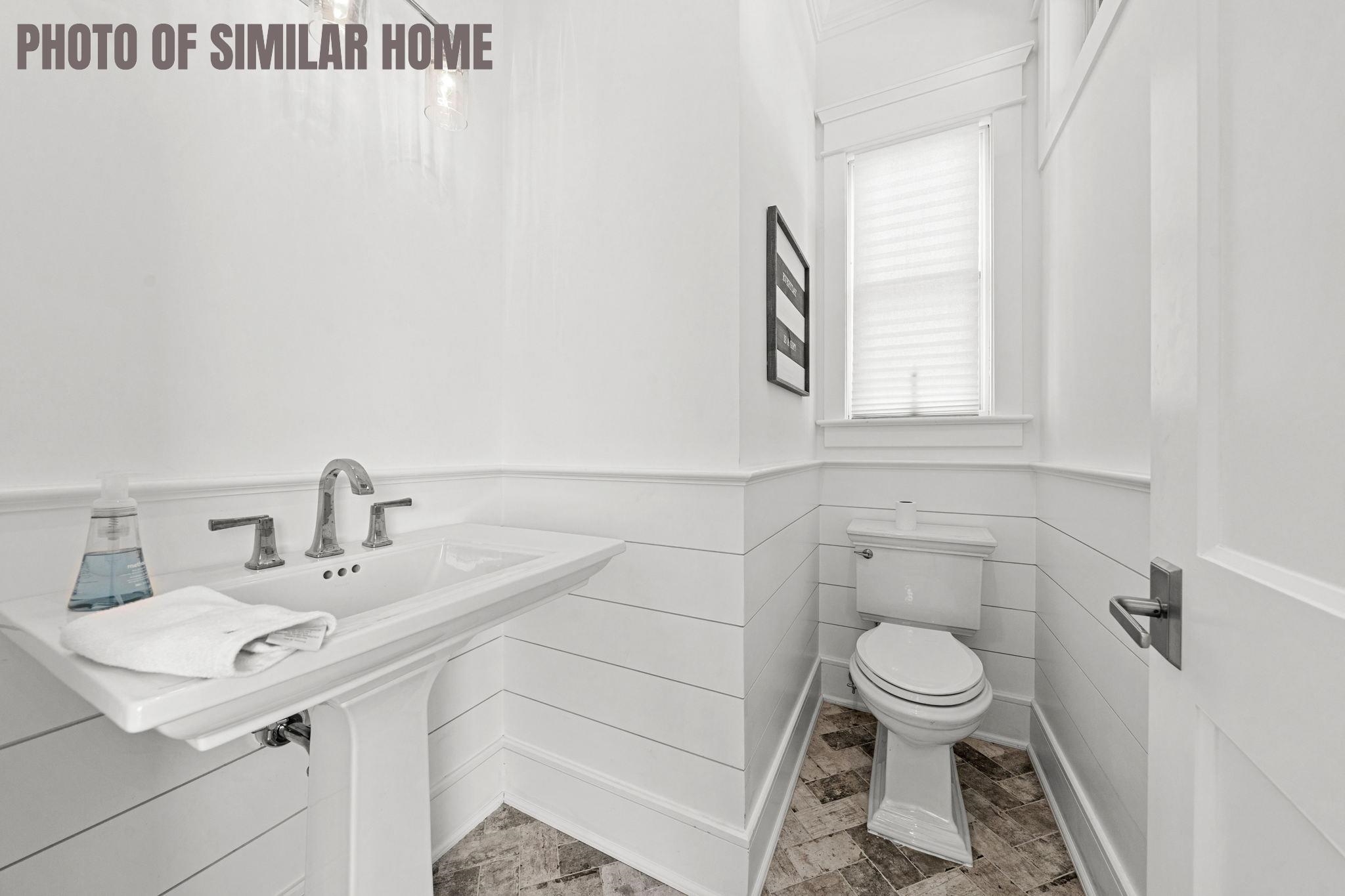 154 98th Street Stone Harbor, NJ 08247 - Photo 24 of 50 a bathroom with a sink toilet and mirror