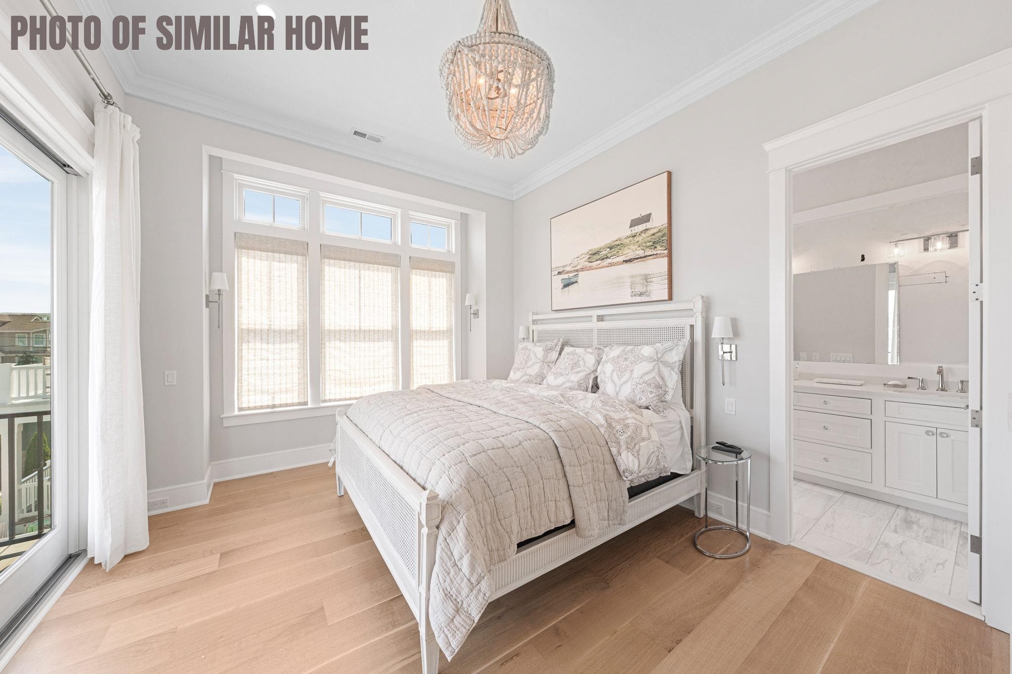 154 98th Street Stone Harbor, NJ 08247 - Photo 7 of 50 a bedroom with a bed and a window