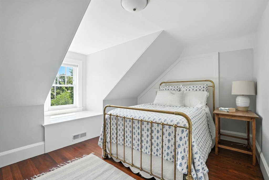15 Winthrop Road Lexington, MA 02421 - Photo 35 of 39 a bedroom with a bed and a window