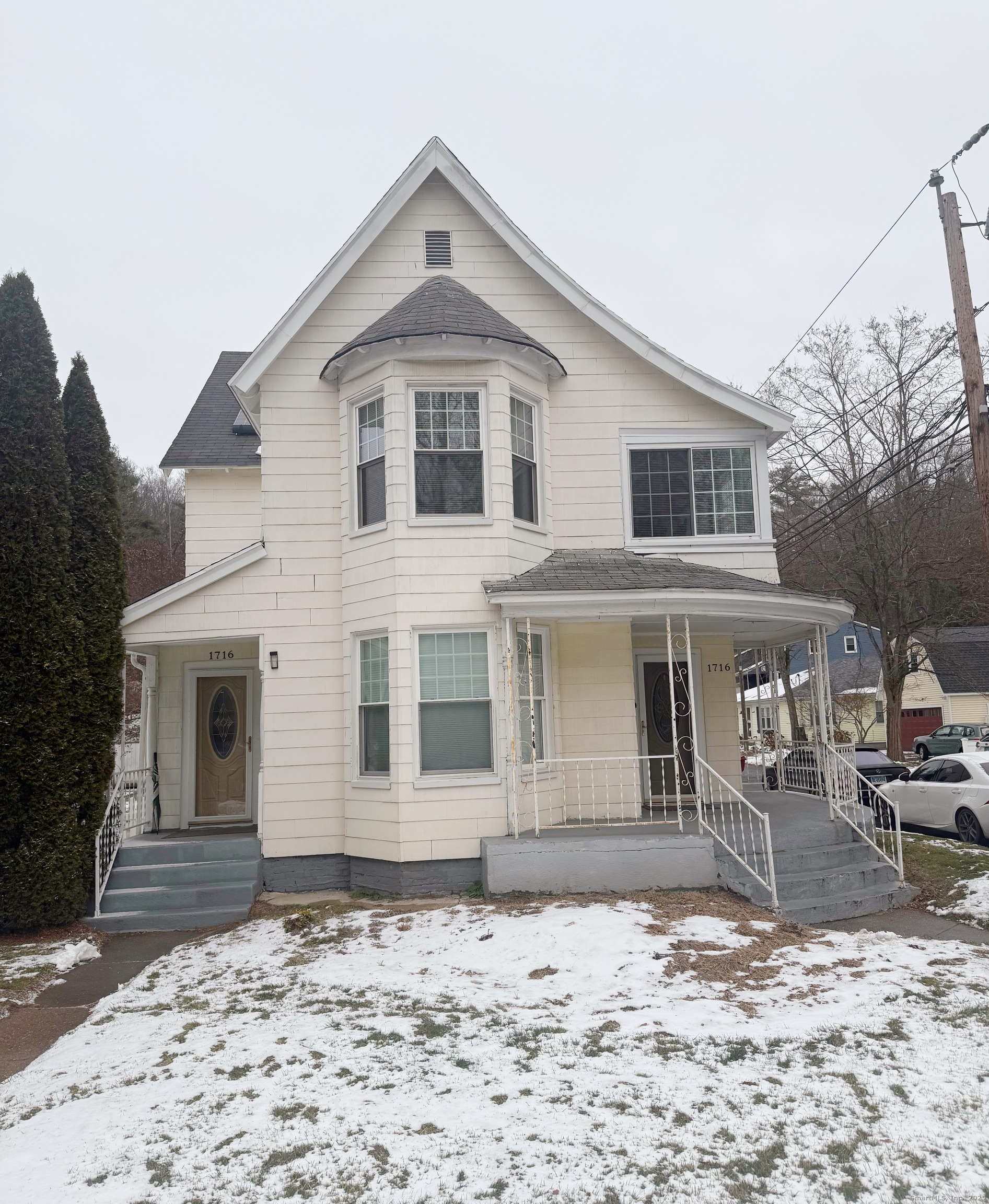 a front view of a house with sitting area