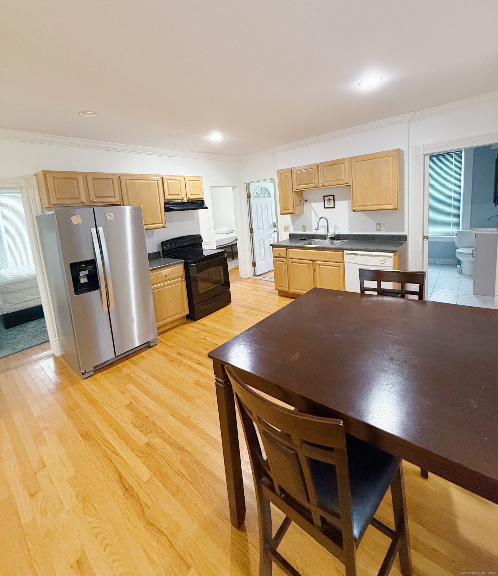 1716 Farmington Avenue Farmington, CT 06085 - Photo 14 of 17 a view of a dining room with furniture and a kitchen