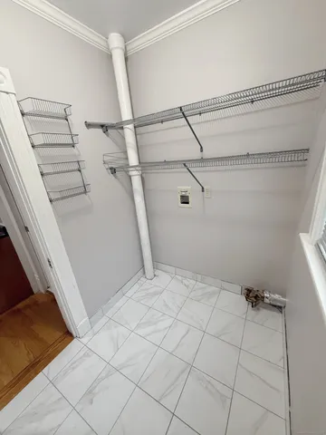 a view of a room with racks on the wall