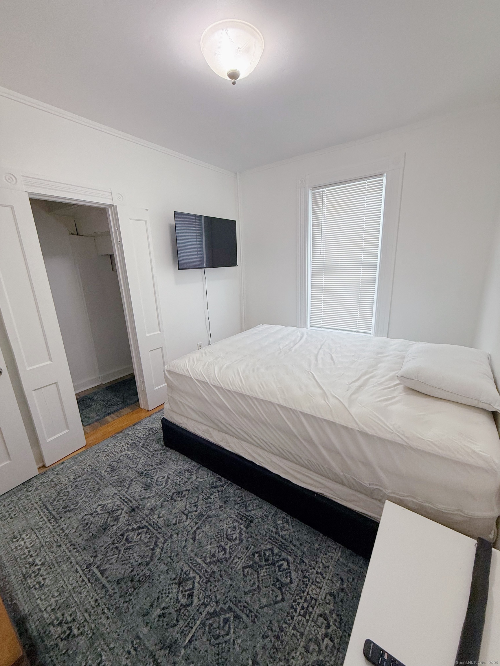 1716 Farmington Avenue Farmington, CT 06085 - Photo 9 of 17 a bedroom with a bed and a dresser