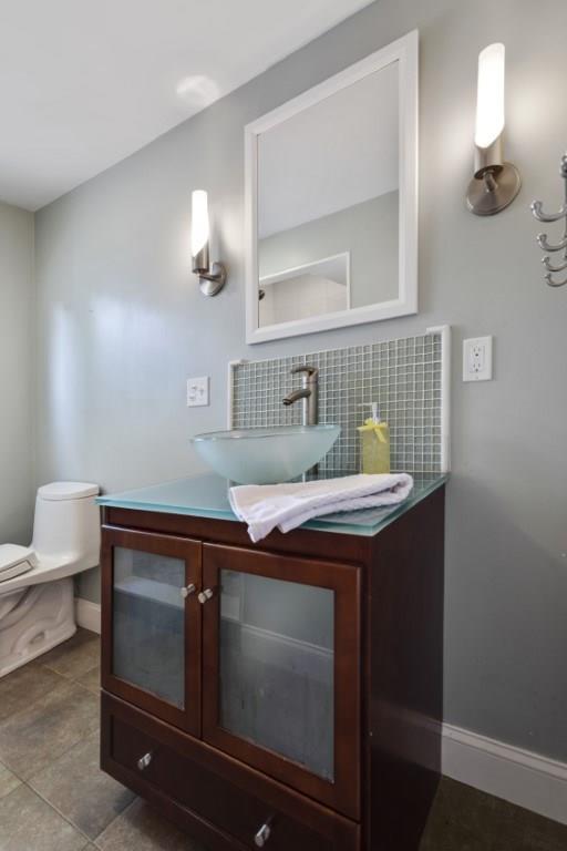 22 Irving Street Reading, MA 01867 - Photo 20 of 37 a bathroom with a sink and a mirror