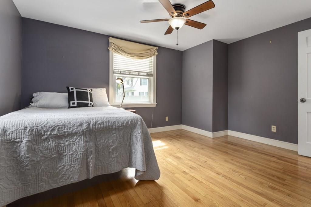 22 Irving Street Reading, MA 01867 - Photo 24 of 37 a bedroom with a large bed and a window