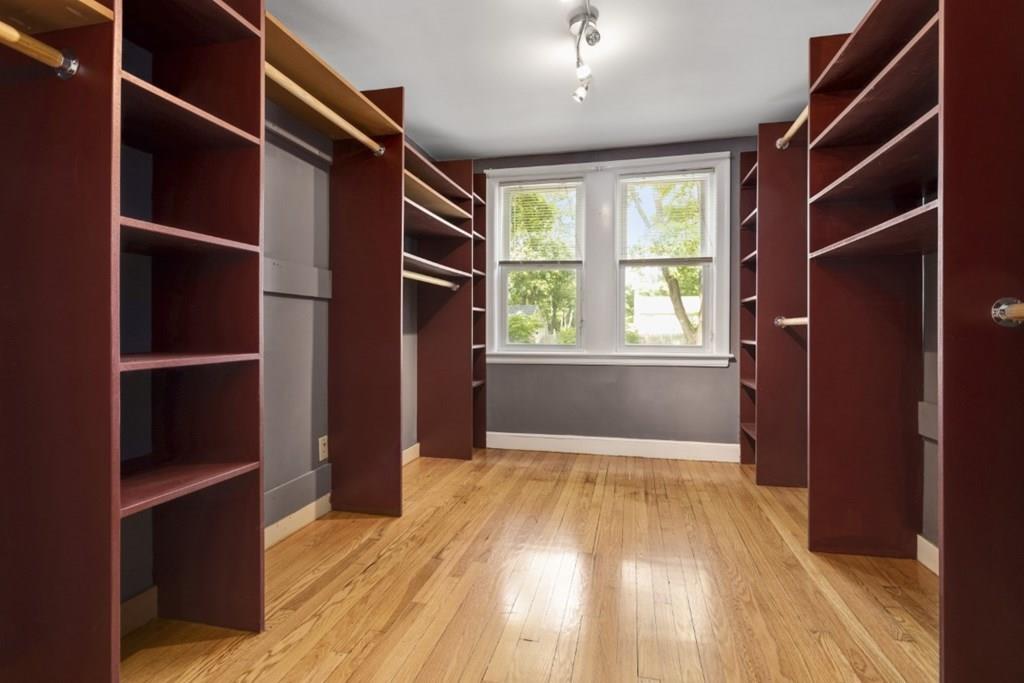 22 Irving Street Reading, MA 01867 - Photo 26 of 37 a view of an empty room with wooden floor and a window