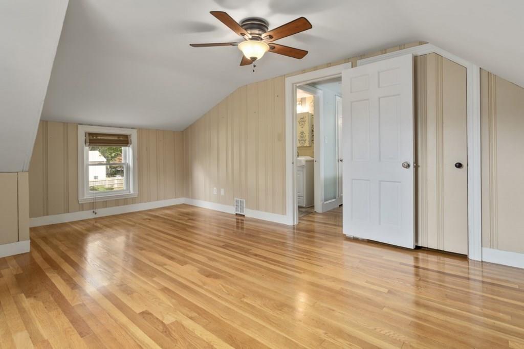 22 Irving Street Reading, MA 01867 - Photo 28 of 37 a view of an empty room with window and wooden floor