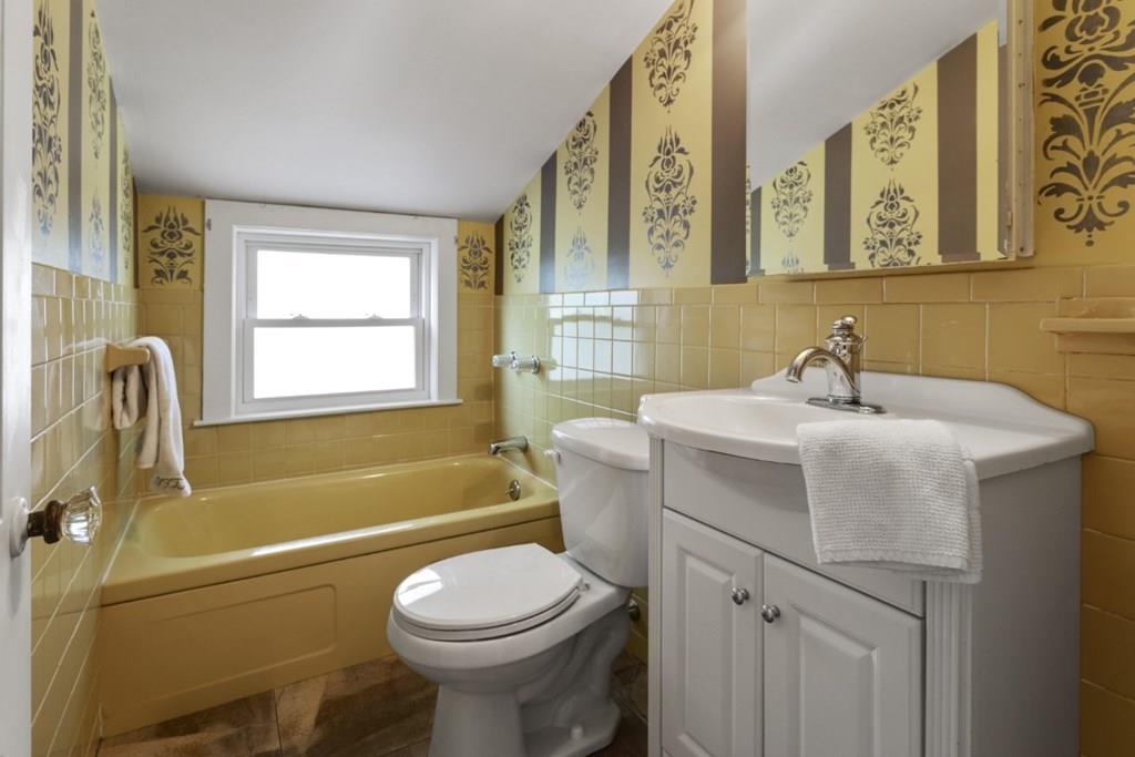 22 Irving Street Reading, MA 01867 - Photo 29 of 37 a bathroom with a sink toilet and shower