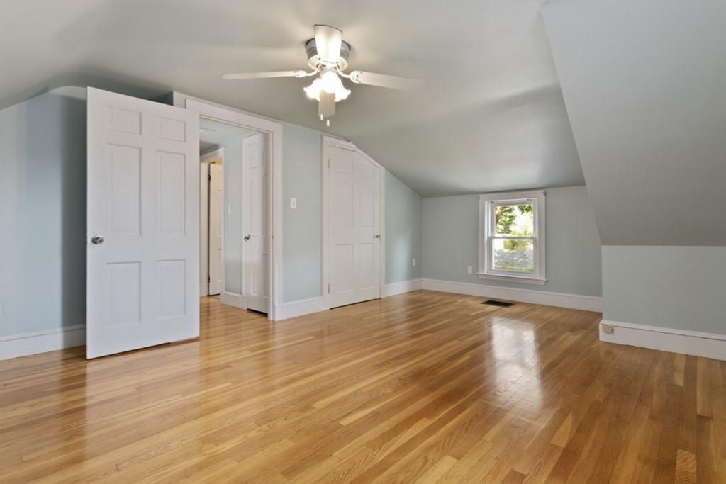 22 Irving Street Reading, MA 01867 - Photo 31 of 37 wooden floor in an empty room with a window
