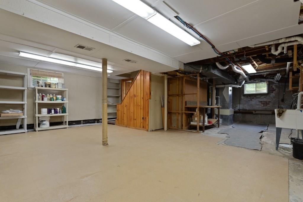 22 Irving Street Reading, MA 01867 - Photo 32 of 37 a view of a room with gym equipment