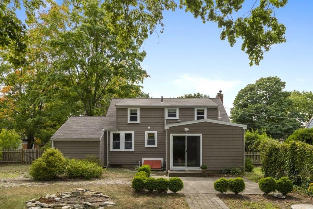 22 Irving Street Reading, MA 01867 - Photo 34 of 37 a front view of a house with a garden
