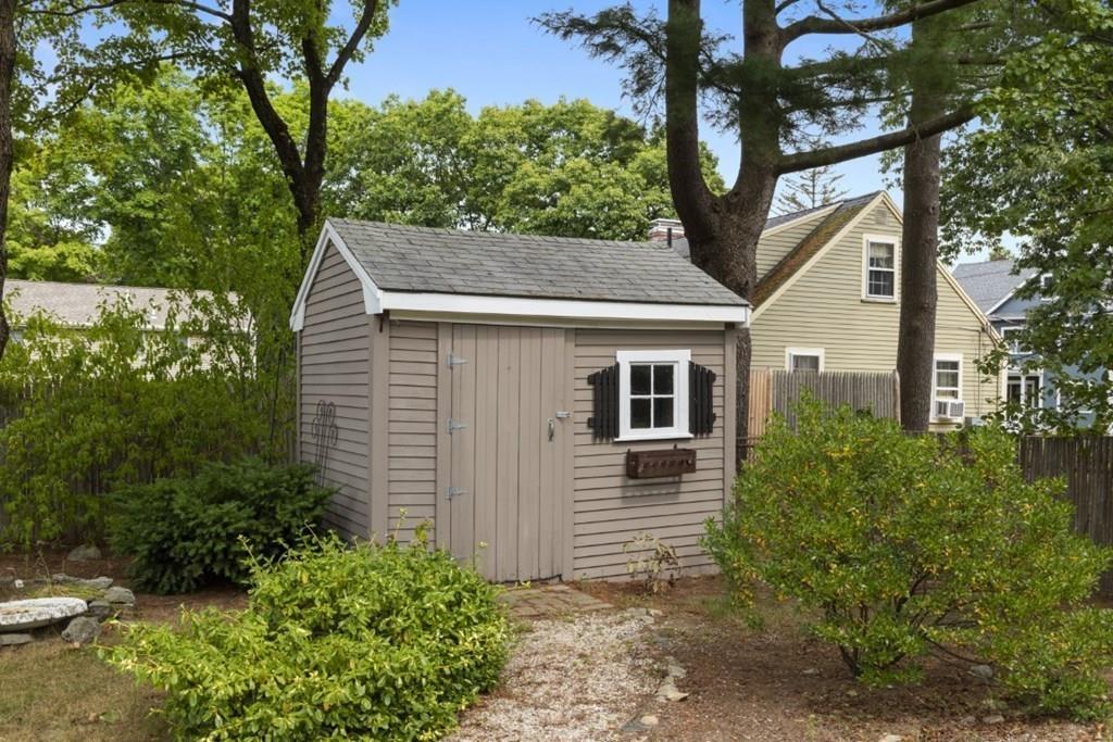 22 Irving Street Reading, MA 01867 - Photo 37 of 37 a house that has a tree in front of the house