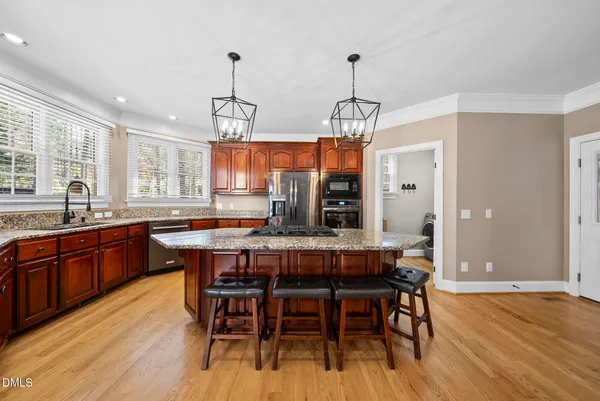 an empty room with ceiling fan and window