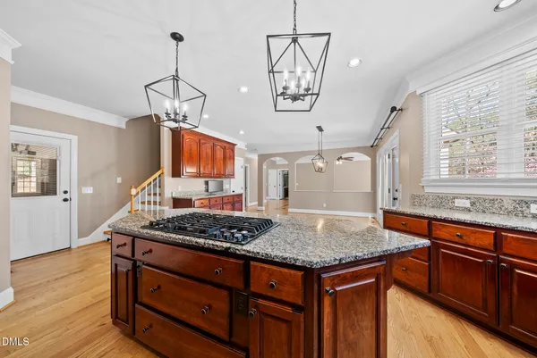 a spacious bathroom with a granite countertop sink mirror and bathtub