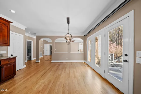 a spacious bathroom with a granite countertop sink mirror and shower