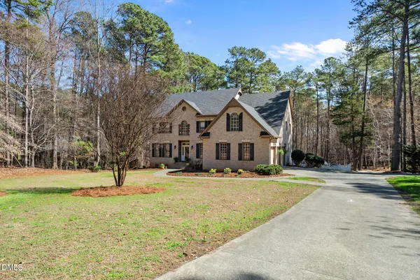 a aerial view of a house with a yard