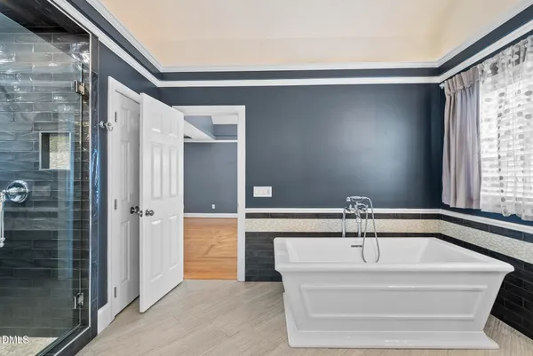 a view of an empty room with wooden walls