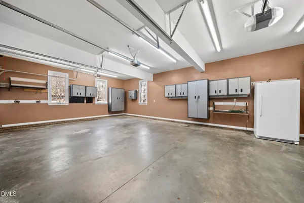 an aerial view of a house with a yard and swimming pool