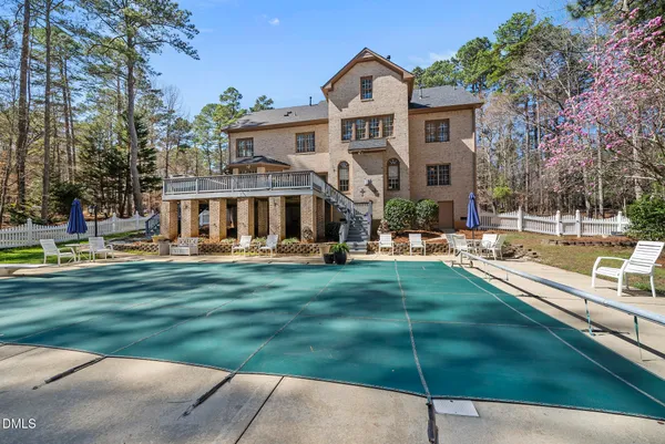 an aerial view of house with yard and seating area