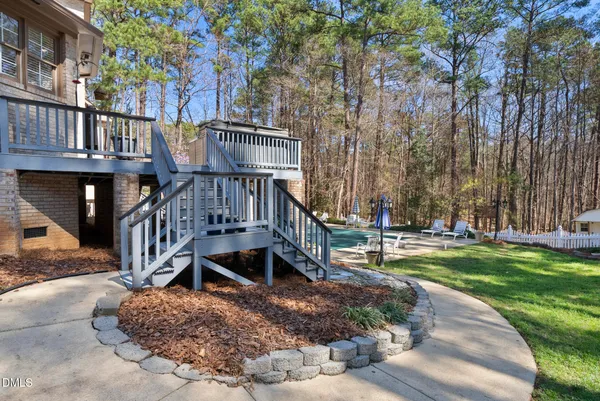 an aerial view of a house with swimming pool