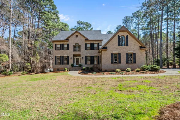 a view of a livingroom with a ceiling fan and window