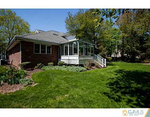 288 Plainfield Road Edison, NJ 08820 - Photo 22 of 24 a front view of a house with a yard