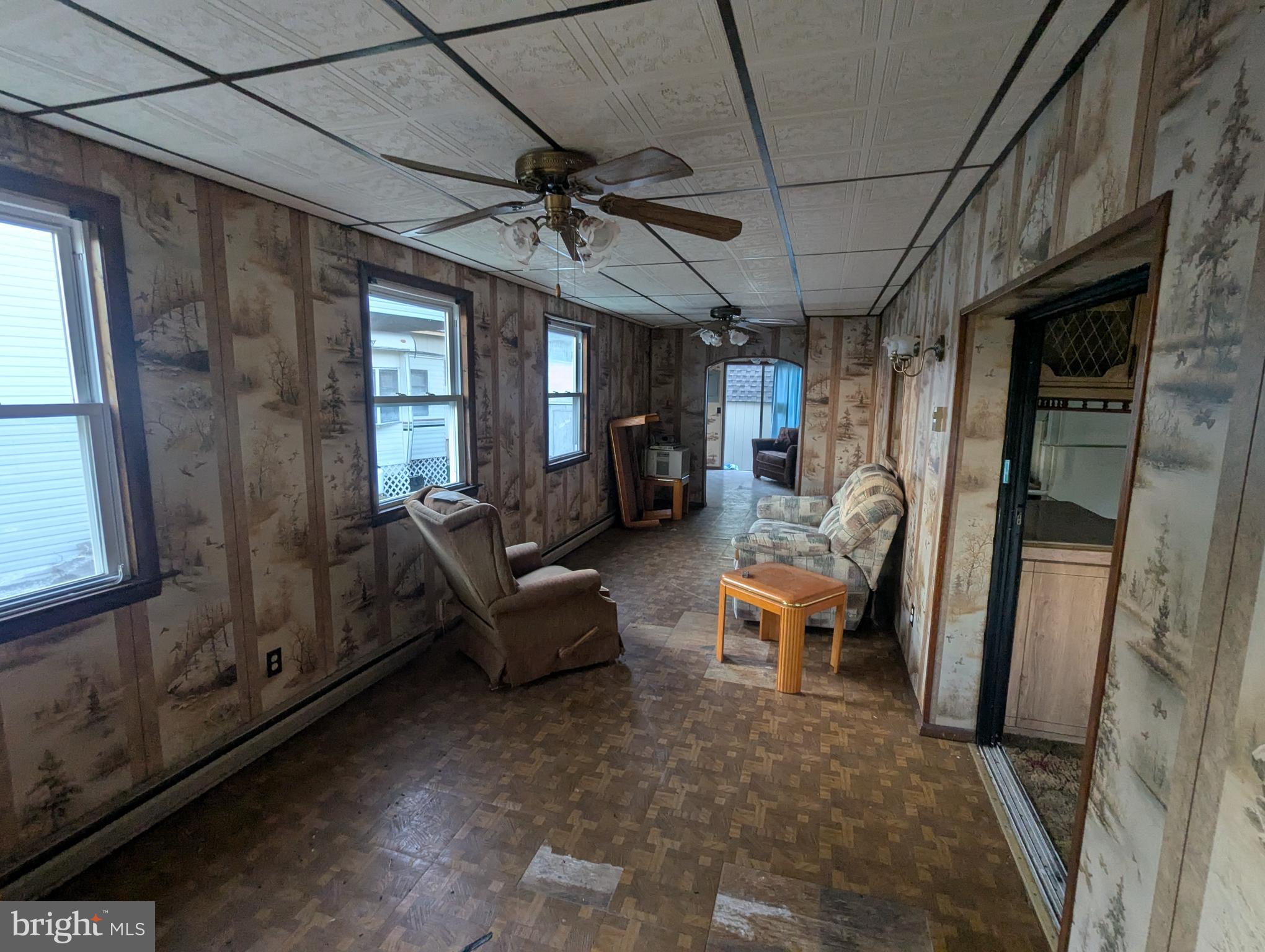 5 Hilo Road Falling Waters, WV 25419 - Photo 5 of 19 a living room with furniture and a chandelier