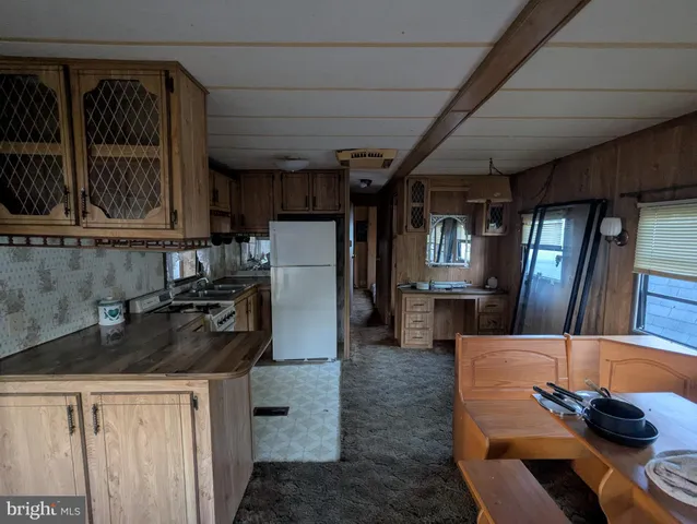 a view of kitchen and hallway