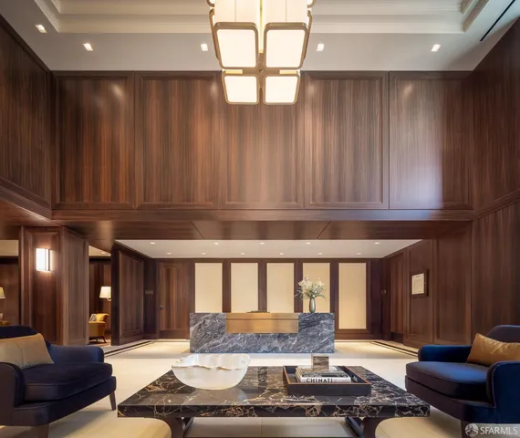 a living room with furniture and large windows