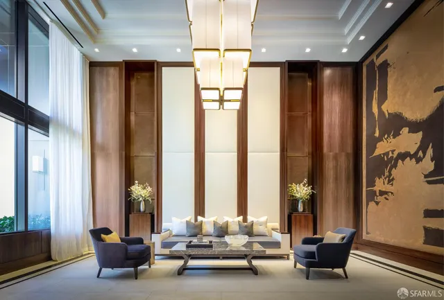 a lobby with furniture and a fireplace