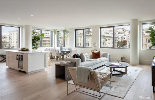 a living room with furniture and windows
