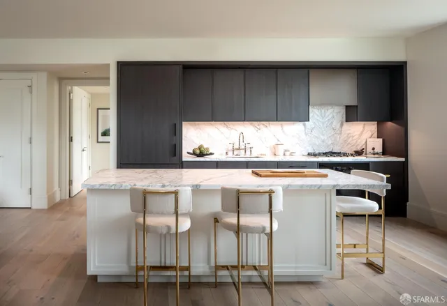 a kitchen with a table and chairs