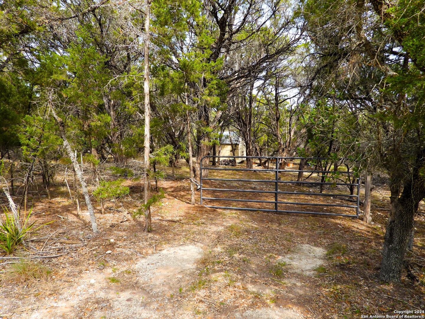 Tbd Simmons Road Lakehills, TX 78063 - Photo 2 of 22 a view of outdoor space with deck and trees