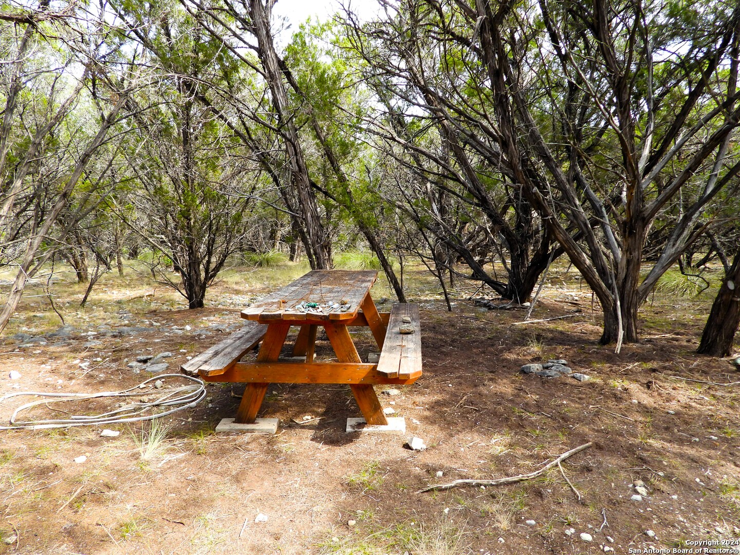 Tbd Simmons Road Lakehills, TX 78063 - Photo 3 of 22 a view of a yard with wooden fence and trees
