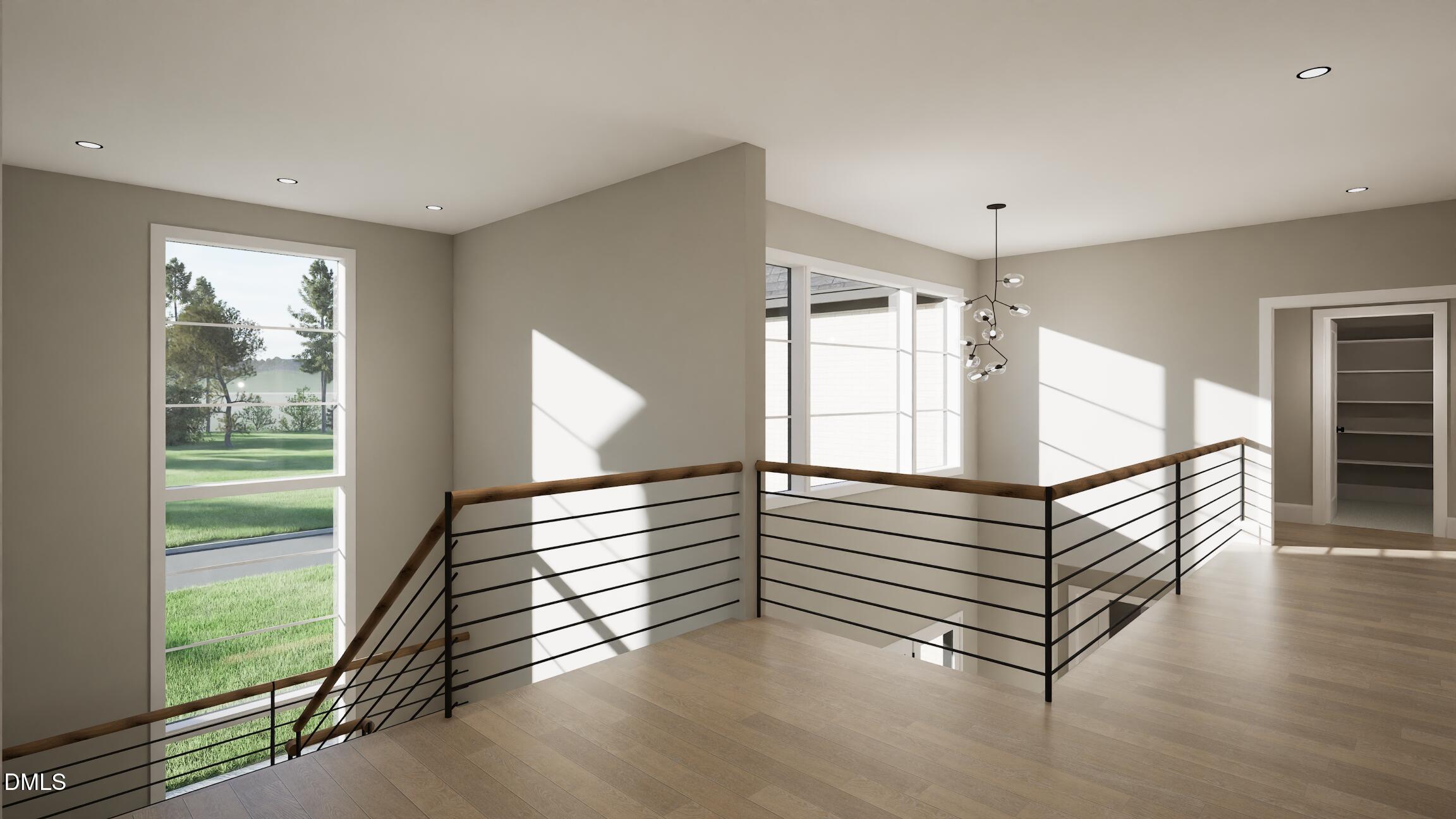 408 Shinleaf Pond Trail Raleigh, NC 27614 - Photo 28 of 77 a view of an empty room with wooden floor and a window