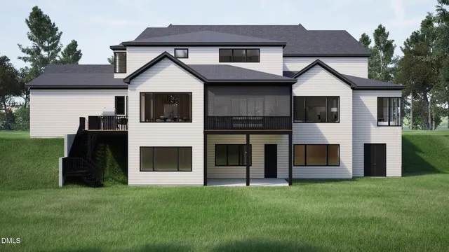 a front view of a house with a yard and trees