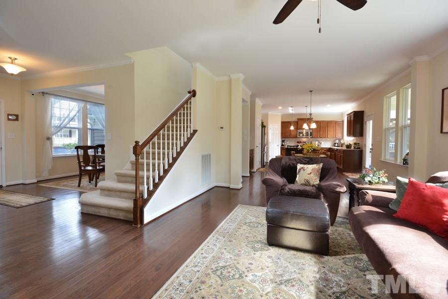 1007 Lakeview Road Durham, NC 27712 - Photo 14 of 25 a living room with furniture or wooden floor and a chandelier