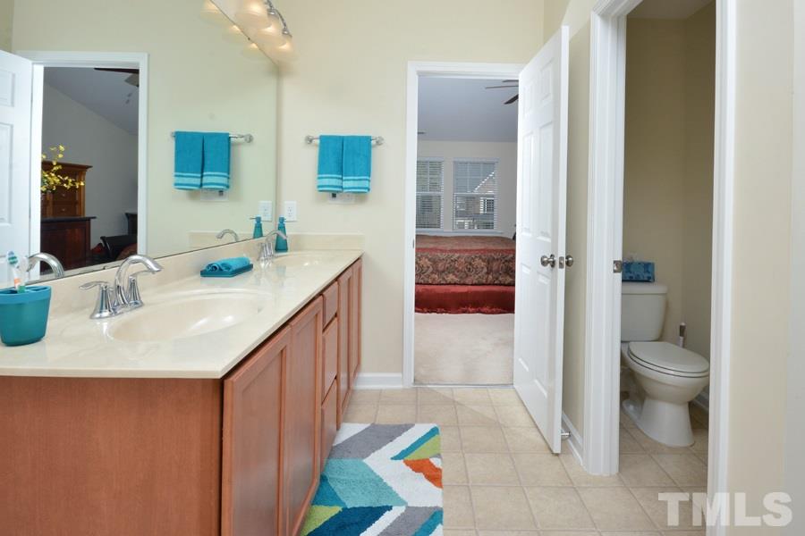 1007 Lakeview Road Durham, NC 27712 - Photo 17 of 25 a bathroom with a sink a toilet and shower