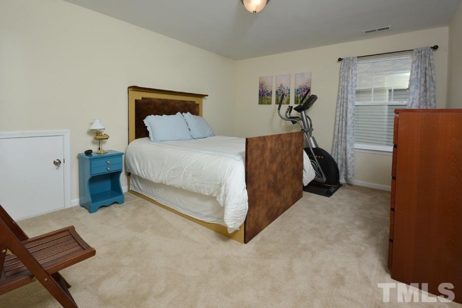 1007 Lakeview Road Durham, NC 27712 - Photo 18 of 25 a bed room with a bed and a window