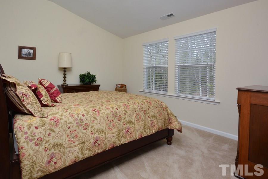 1007 Lakeview Road Durham, NC 27712 - Photo 19 of 25 a bed sitting in a bedroom next to a window