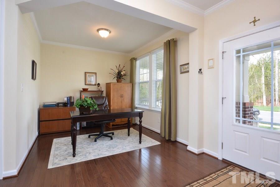 1007 Lakeview Road Durham, NC 27712 - Photo 3 of 25 a view of a workspace room with wooden floor and windows