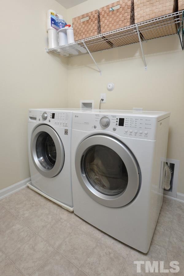 1007 Lakeview Road Durham, NC 27712 - Photo 23 of 25 a utility room with dryer and washer